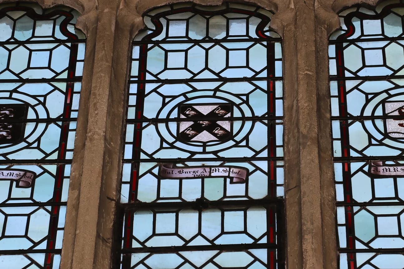 The arms of William Burge, in Wadham College's antechapel - coat of arms on stained glass window. 
