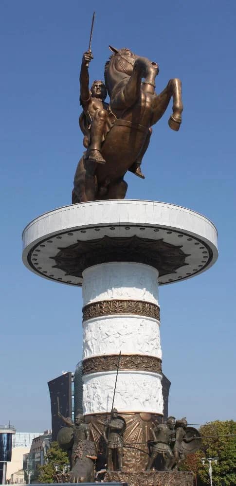 Bronze statue of a man on a horse holding a sword. 