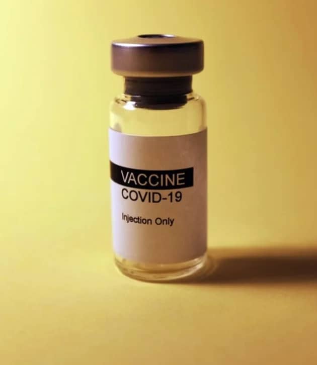 Stock photograph of a vial of vaccine. 