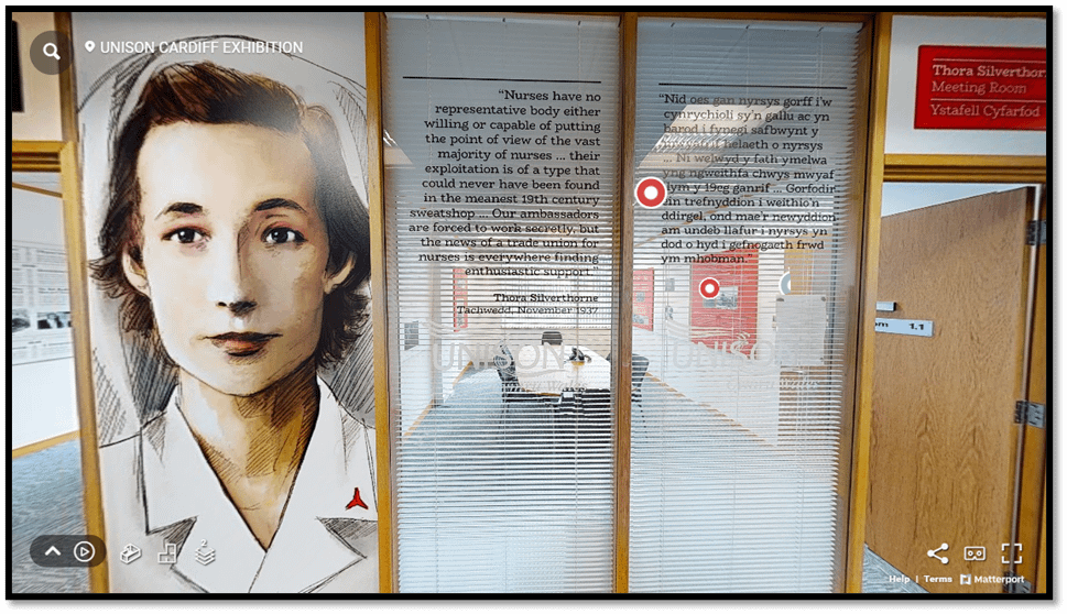 Picture of glass panels around a waiting room, with the drawing of the portrait of a woman and some text added to the panels.
