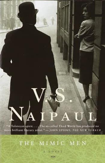 The front cover of the book 'The Mimic Men' by V.S. Naipaul, showing a black and white image of a man in black coat and top hat, looking at a lady smoking a cigarette.