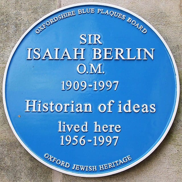 Blue plaque on a wall 
